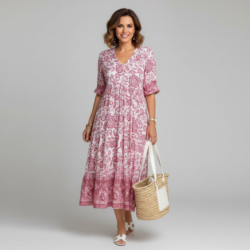 Flowy women's floral tiered midi dress with a stylish V-neck and three-quarter sleeves. Perfect summer occasion wear.
