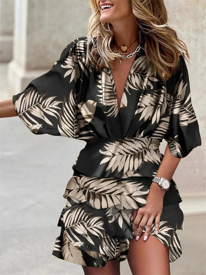 Flattering women's floral mini dress, V-neck, ruffles & flowy batwing sleeves, ideal for casual elegance.