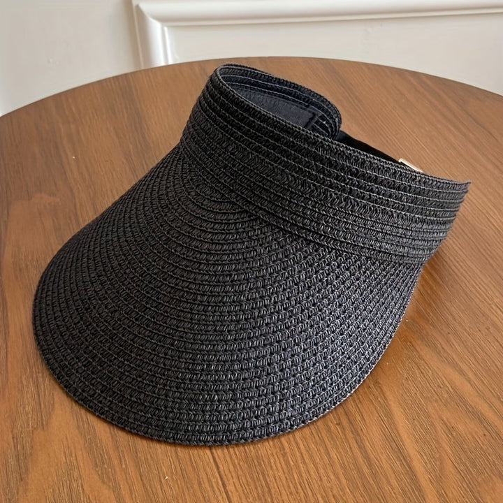 Breathable women's foldable visor with wide brim, designed for comfortable sun protection during summer.