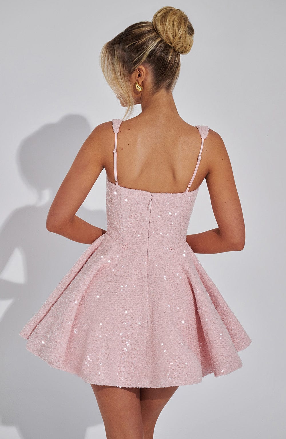 Glamorous sequin A-line mini dress for women, with a unique square neck design and a lovely decorative back bow.