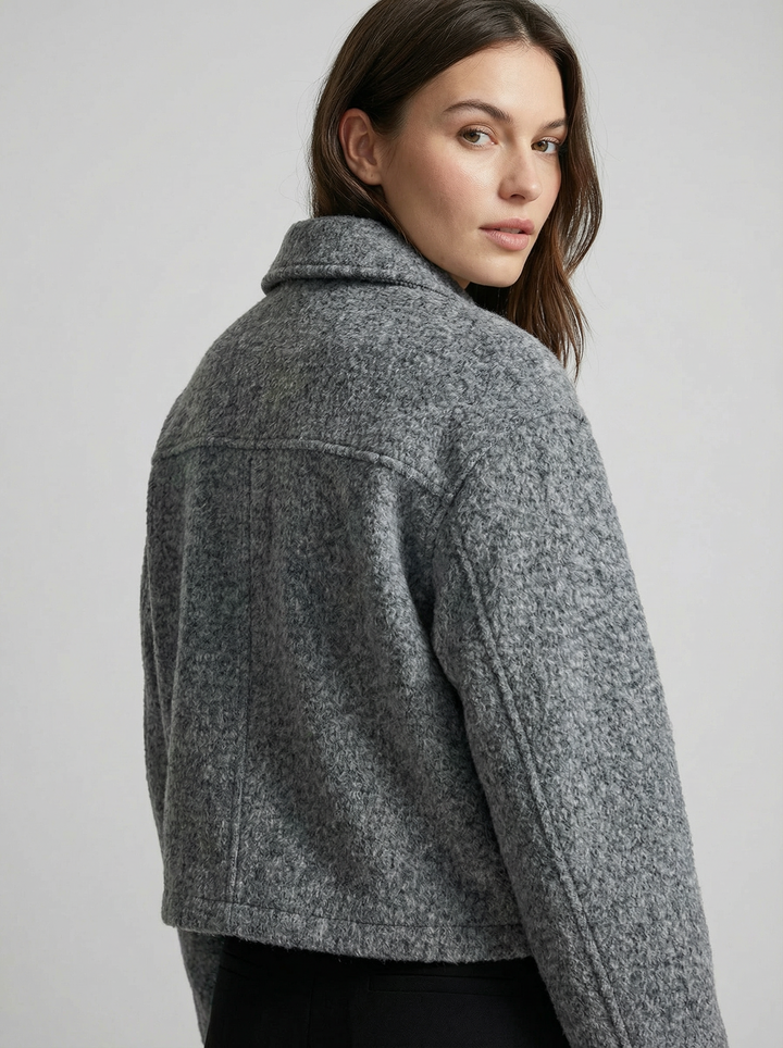Stylish women's gray cropped zip jacket, ideal outerwear for versatile spring & autumn layering. Features front pockets.