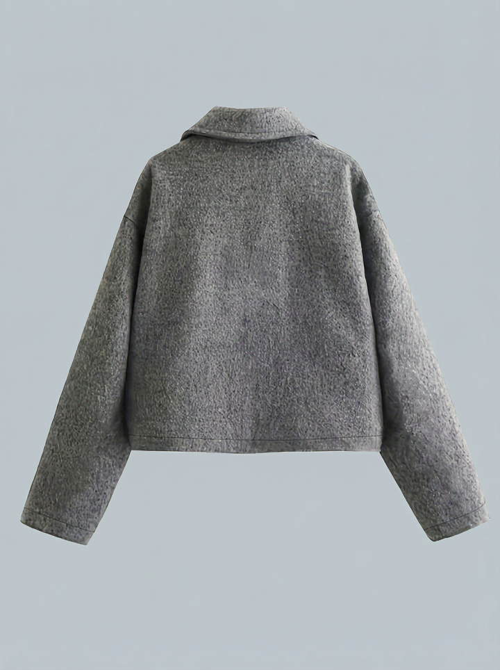 Women's gray cropped zip jacket with front pockets. Versatile outerwear for spring, autumn, & casual layering.