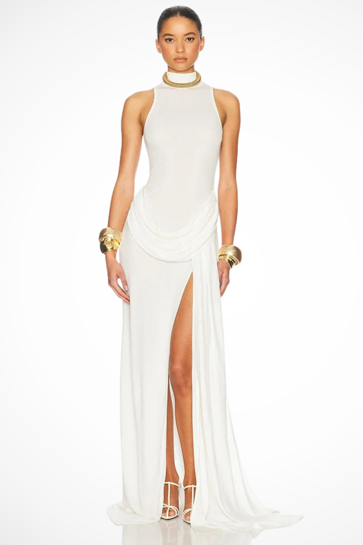 White high neck sleeveless maxi dress with a flattering side split, an elegant choice for summer parties or events.