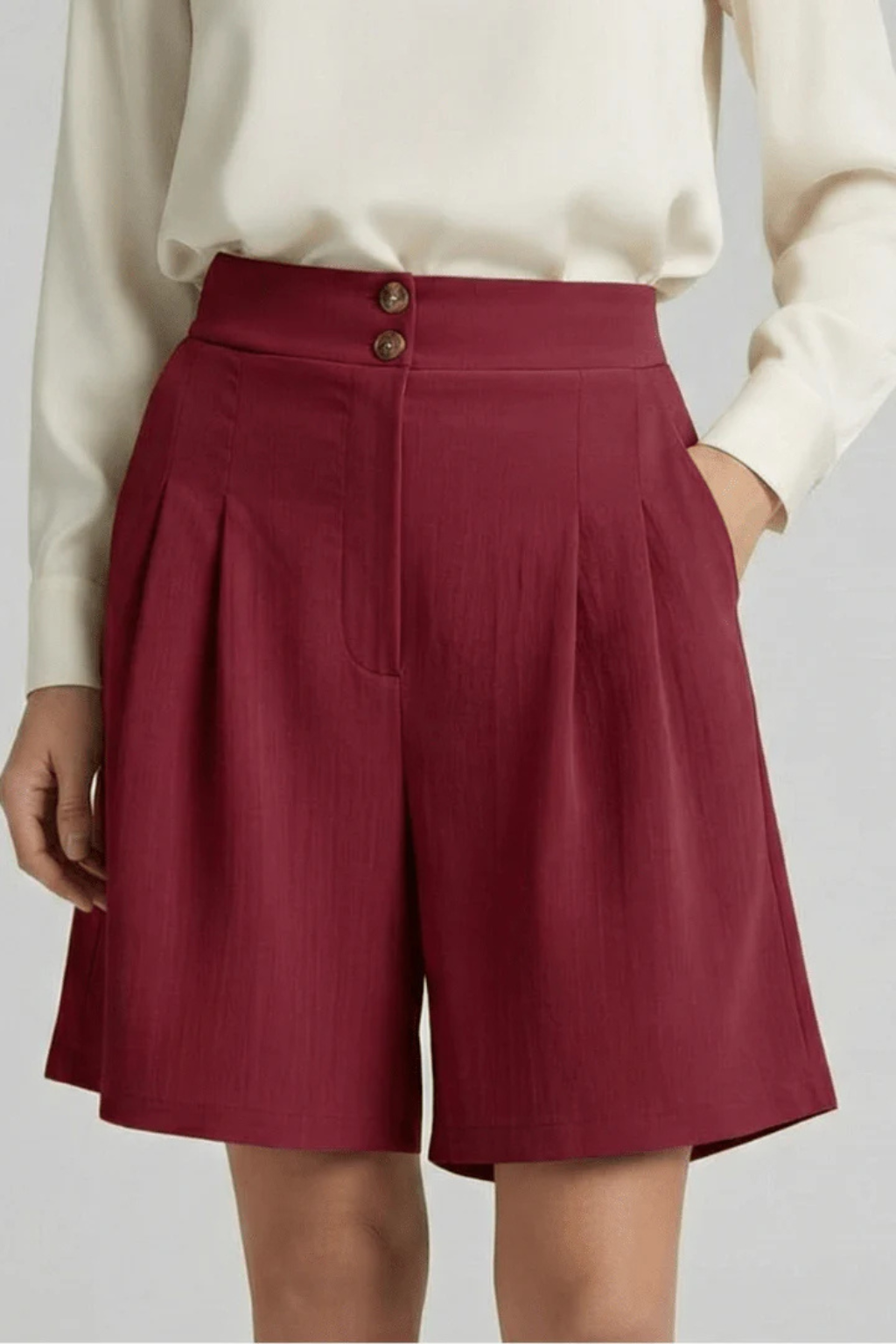 Women's elegant high waist pleated tailored Bermuda shorts, perfect blend of comfort & style.