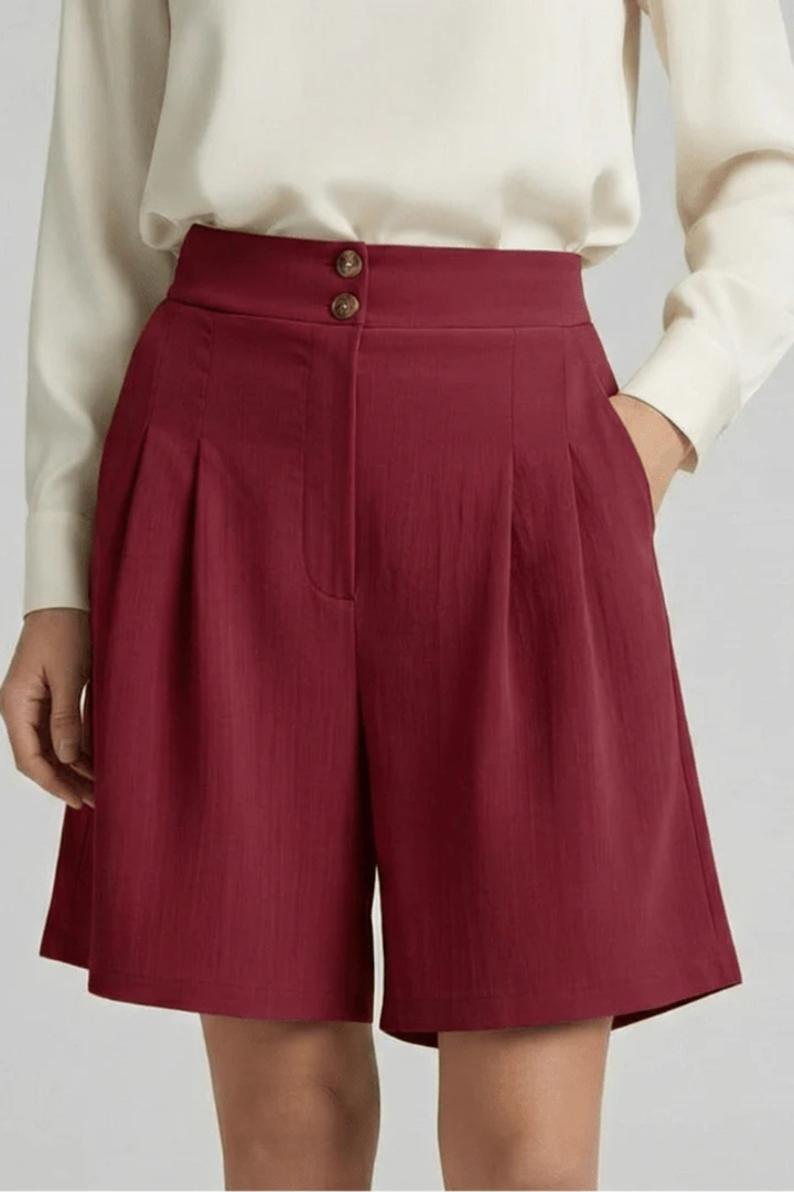 Women's elegant high waist pleated tailored Bermuda shorts, perfect blend of comfort & style.