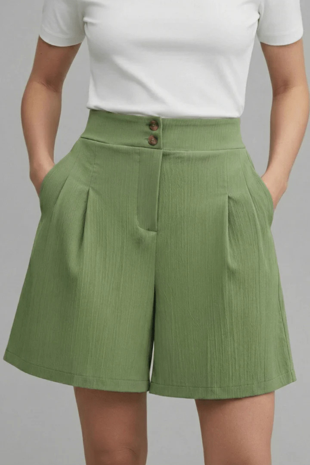 High-waist pleated bermuda shorts, women's tailored fit, button & pocket details.