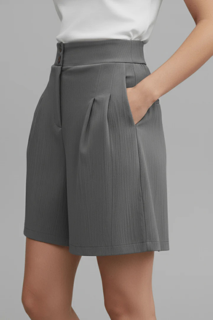 High-waist pleated tailored shorts for women, comfortable & chic, button front closure.