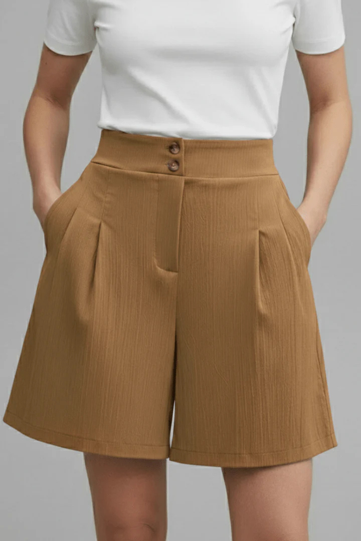 Tailored high-waist pleated shorts, women's bermuda style, a chic summer staple.