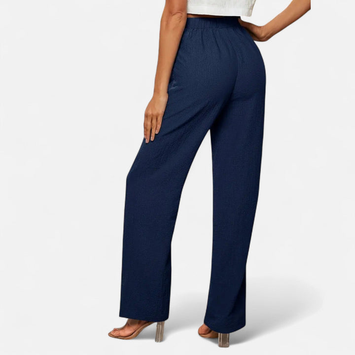 Timeless women's high-waisted straight-leg trousers, essential for modern classic and office fashion.