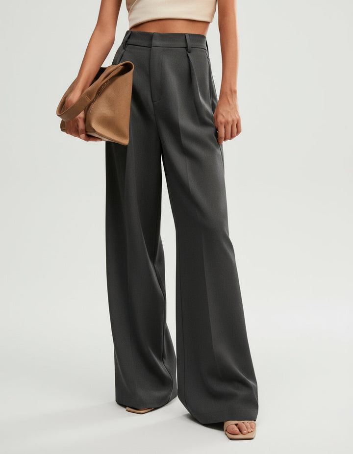 Women's wide leg trousers styled casually, high waist, comfortable yet stylish everyday wear.