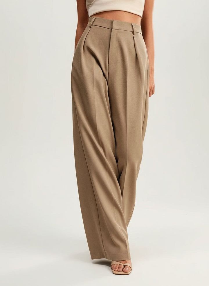 Women walking in high waist wide leg tailored trousers, comfortable movement, fashionable.