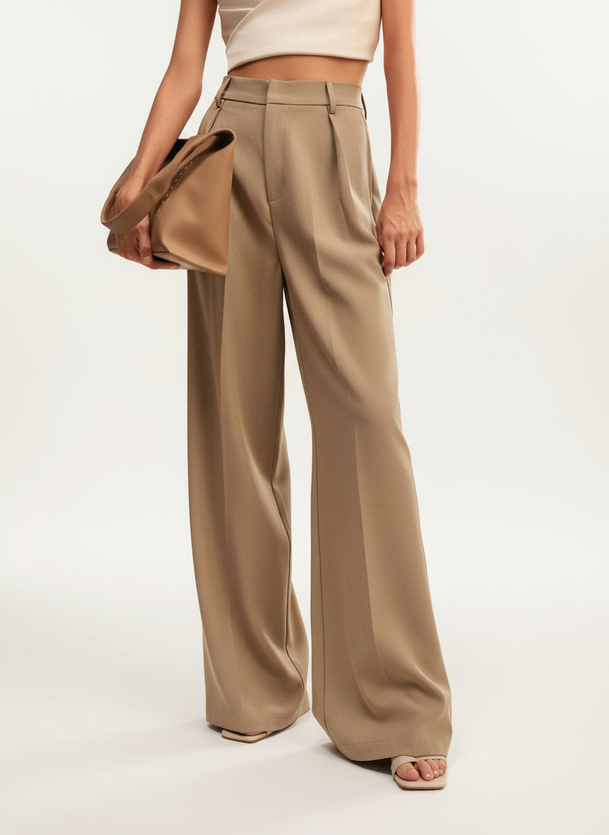 Close-up of fabric on women's high waist wide leg trousers, premium tailored quality.