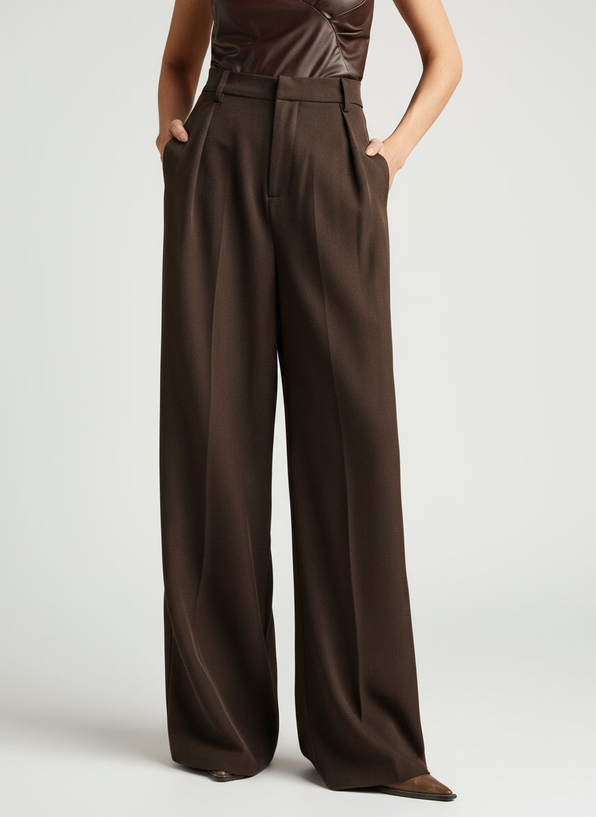 Women's wide leg trousers, high waist, paired with a top for a smart casual look.
