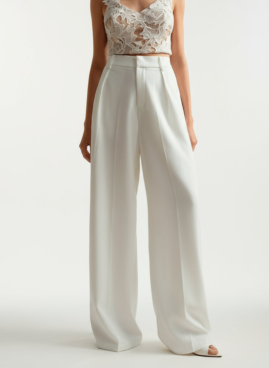 Close-up of tailored wide leg trousers, high waist detail, sophisticated women's fashion pants.