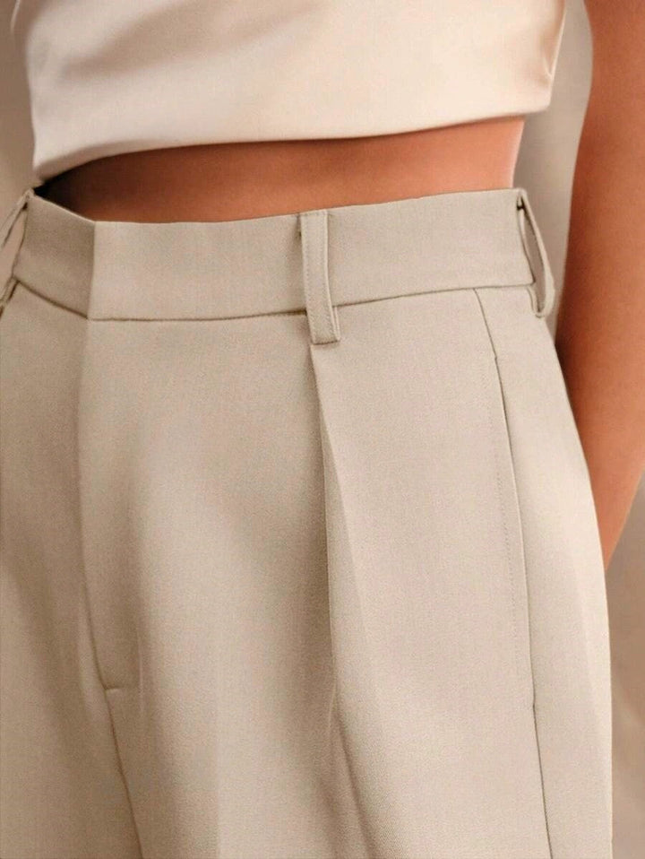 Back view of women's tailored wide leg trousers, high waist, flattering and stylish fashion.
