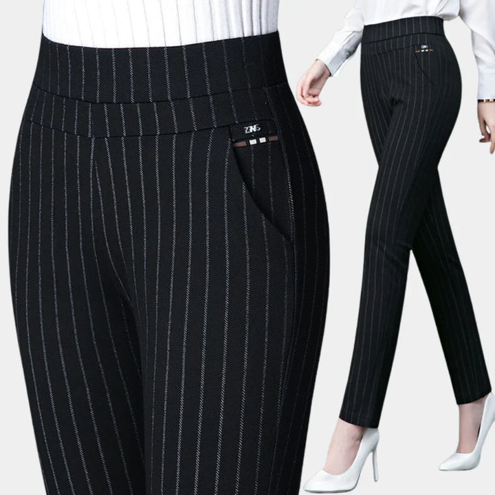 Women's high-waisted black stretch trousers. Comfortable & versatile for office or casual wear. Elastic waist pants.