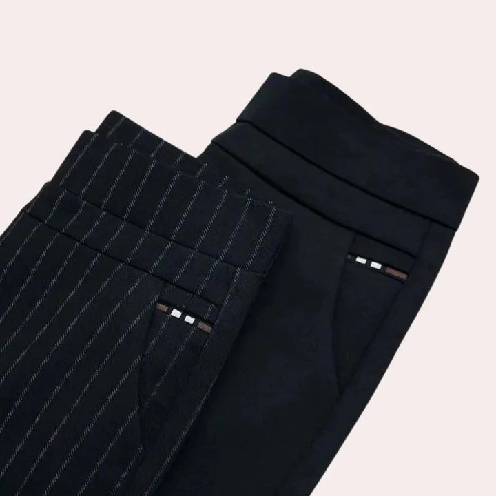 Stylish women's high-waisted stretch trousers in black, offering supreme comfort & an elastic waist.