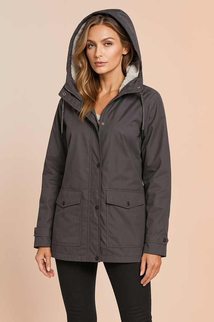 Durable women's insulated winter jacket, perfect for snowy days, with a cozy, warm hood.