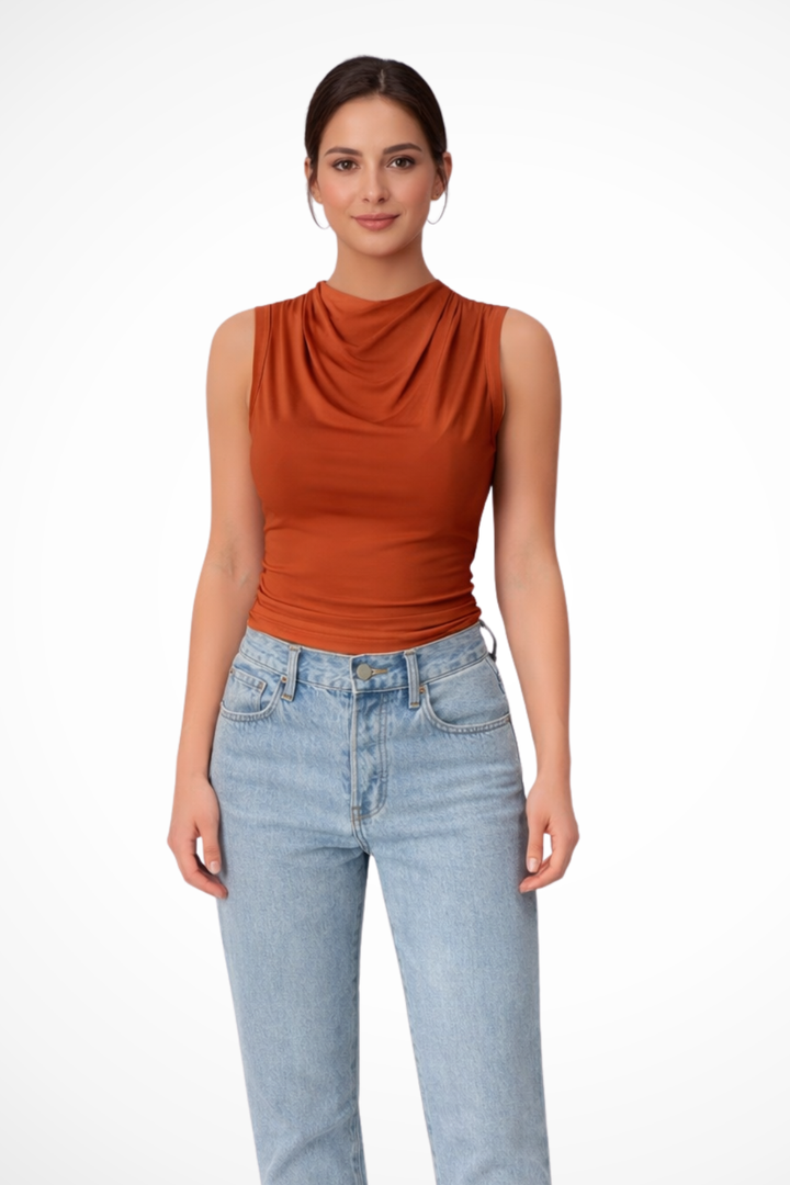 Modern women's sleeveless peplum top with a graceful draped neckline. Stylish & versatile for any spring or summer look.