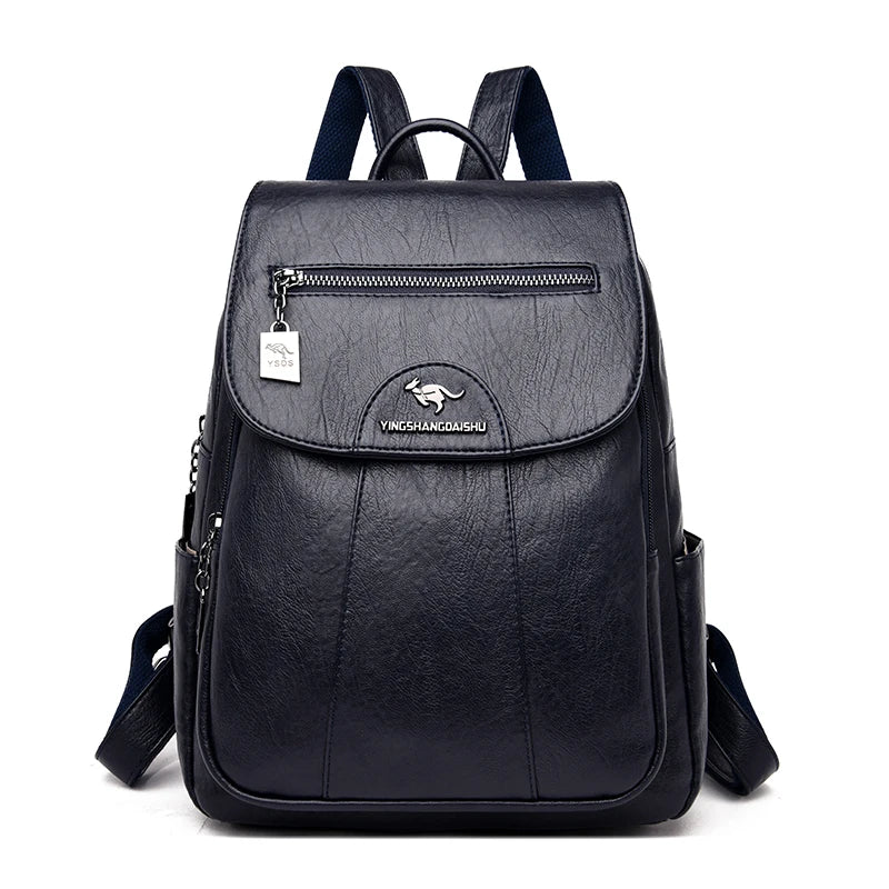 Model wearing a women's large leather anti-theft backpack, a chic and secure travel accessory.