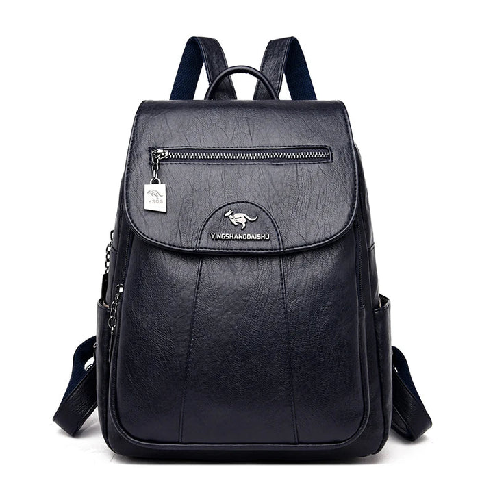 Model wearing a women's large leather anti-theft backpack, a chic and secure travel accessory.