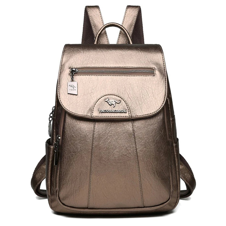 Open view of a women's large leather anti-theft backpack, revealing spacious interior and pockets.