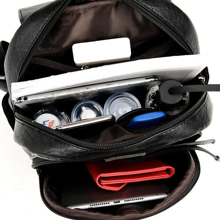 Elegant women's leather anti-theft backpack, ideal for daily essentials & travel.