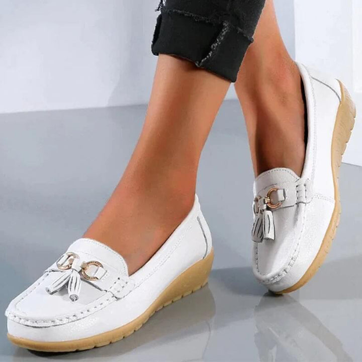Women's timeless leather slip-on loafers, comfort footwear for elegant everyday style.