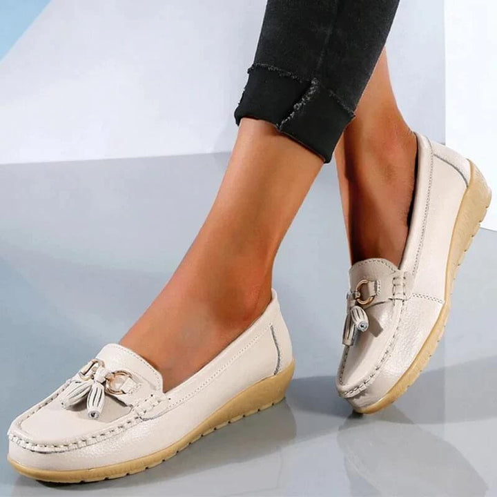 Casual women's leather slip-on loafers, a comfortable and stylish flat shoe for daily wear.