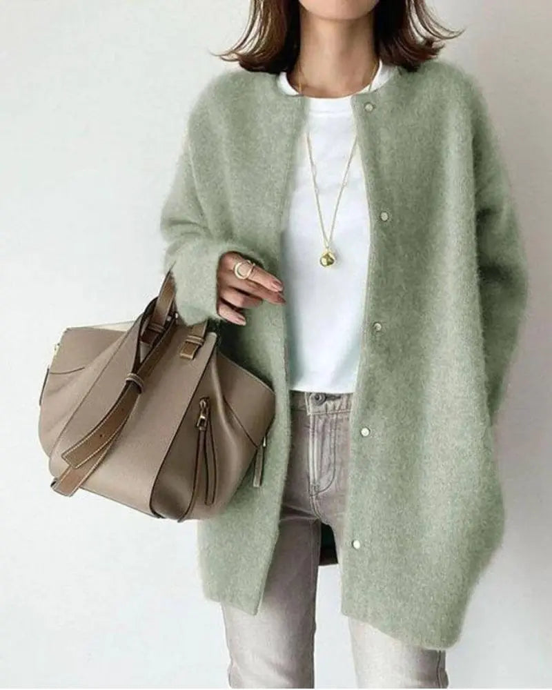 Chic women's open-front cardigan with long sleeves. Ideal for transitional spring and fall fashion layering.