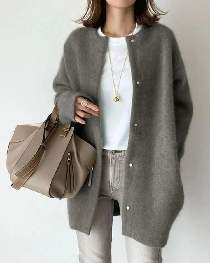 Cozy women's long-sleeve, open-front cardigan in a soft, lightweight fabric for relaxed, chic style.