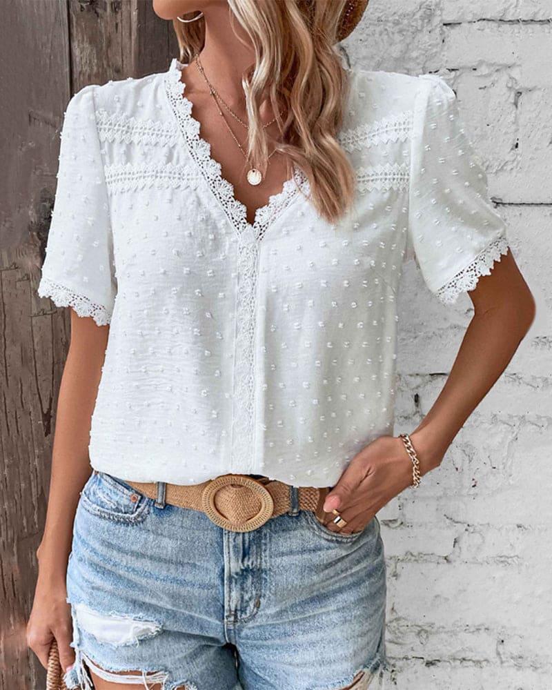Relaxed fit women's V-neck summer blouse, stylish and comfortable for warm days.