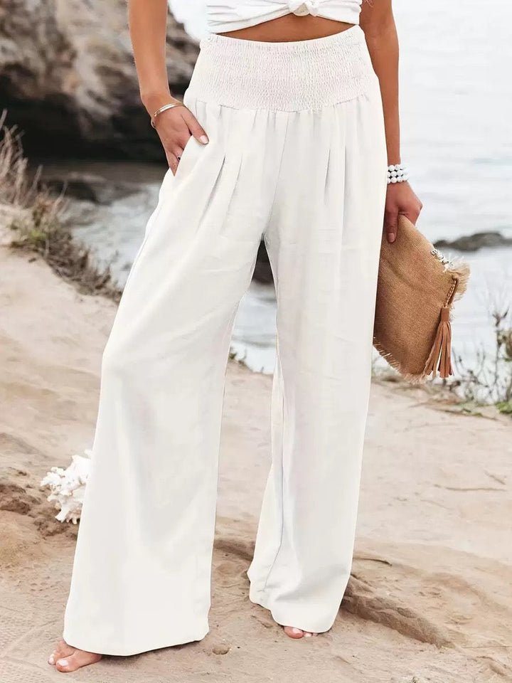 Women's lightweight wide leg linen trousers for breathable summer comfort and style.