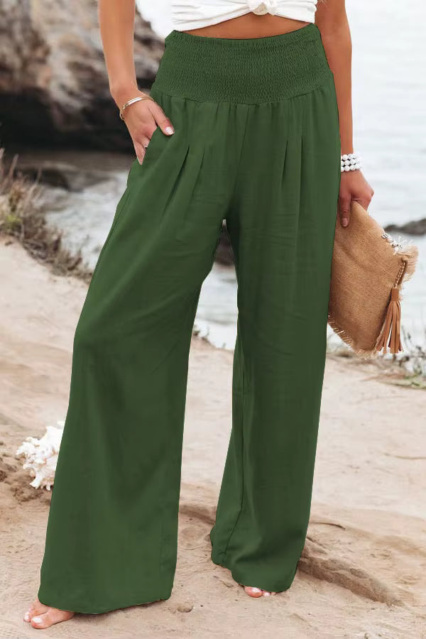 Pink women's wide leg linen pants, high waist and smocked for comfortable summer style.