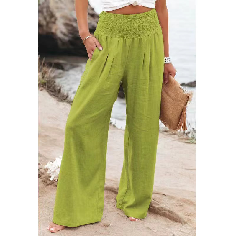 Model wearing flowy wide leg linen trousers for women, showcasing summer fashion fit.