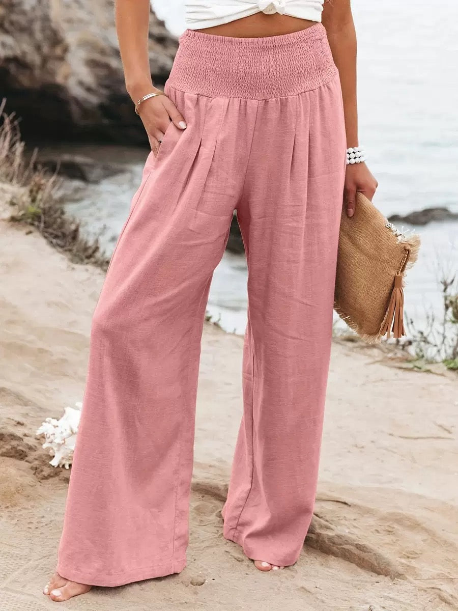 Close-up of the smocked high waist on women's lightweight wide leg linen pants.