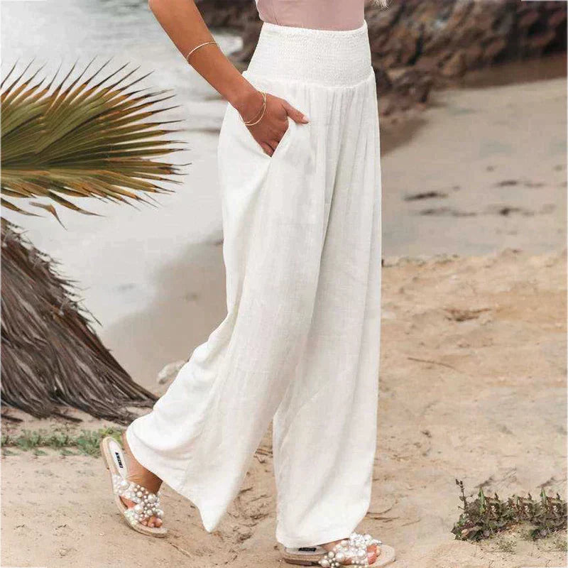 Breathable wide leg linen trousers for women, featuring a high smocked waist design.