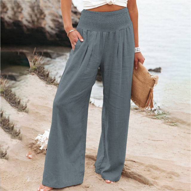 White women's lightweight wide leg linen pants with a comfortable smocked high waist.