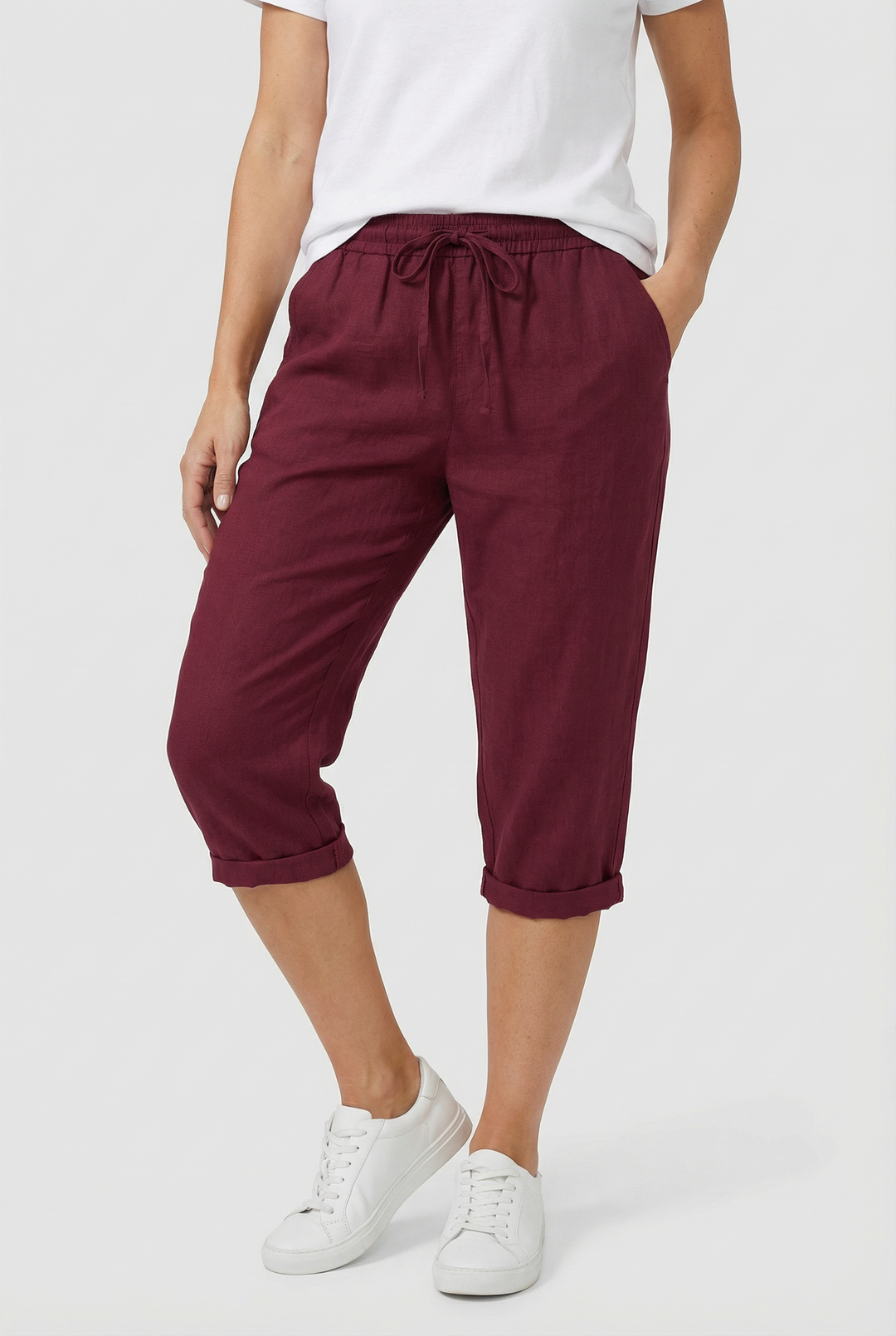 Front view of women's relaxed fit linen capri trousers with an elasticated waist, ideal for summer.