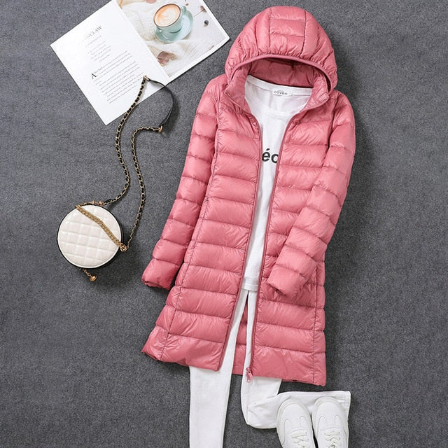 Fashion-forward women's long puffer jacket, an essential winter coat with a detachable hood for style and warmth.