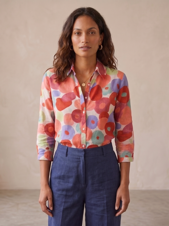 Stylish women's floral button-down blouse with long sleeves, an elegant top for spring fashion and summer looks.