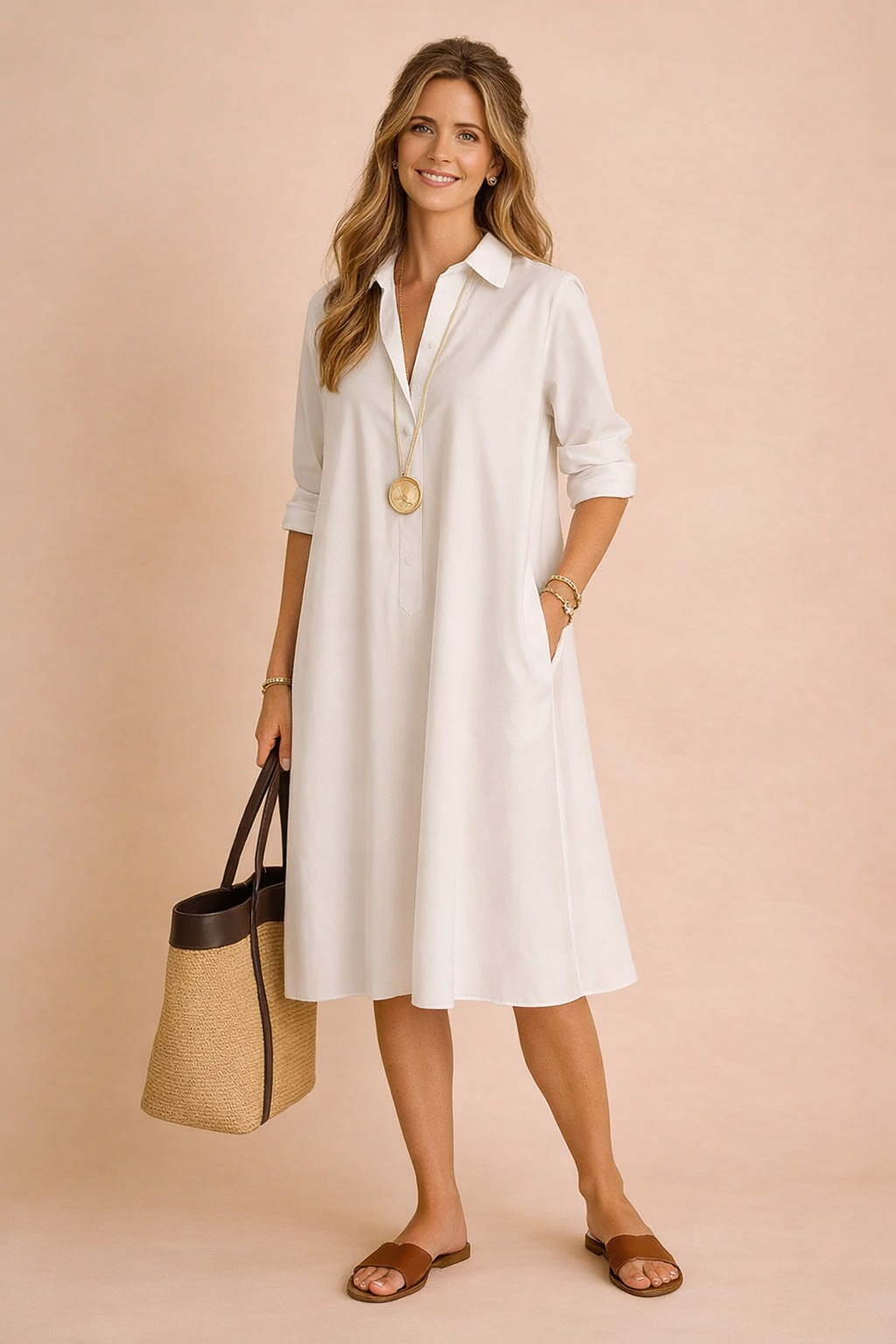Effortless women's loose-fit longline shirt dress featuring a button-front and practical pockets, ideal for comfort.
