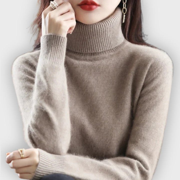 Women's luxurious roll neck sweater. Cozy, elegant long-sleeve knit for winter comfort & style.