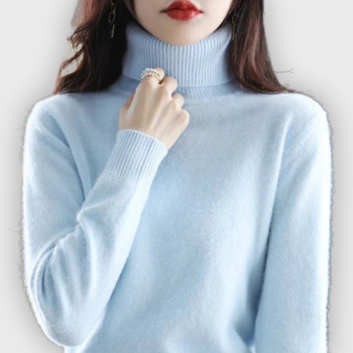 Elegant women's winter sweater. Luxurious roll neck, long-sleeve design for ultimate warmth & style.