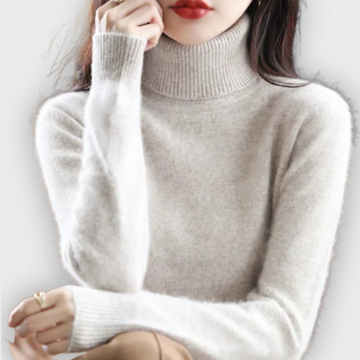 Cozy women's winter sweater with a stylish roll neck. Warm, comfortable & versatile top.