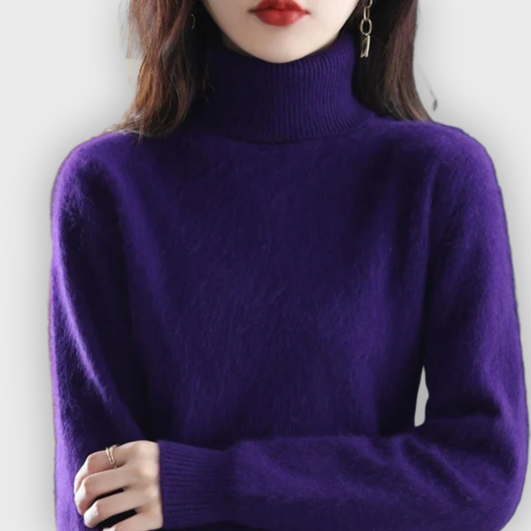 Comfortable women's roll neck sweater. Luxurious knit, perfect for cold weather elegance & coziness.
