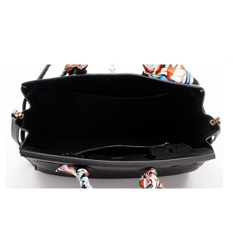 Genuine leather women's handbag, chic accessory with designer appeal.
