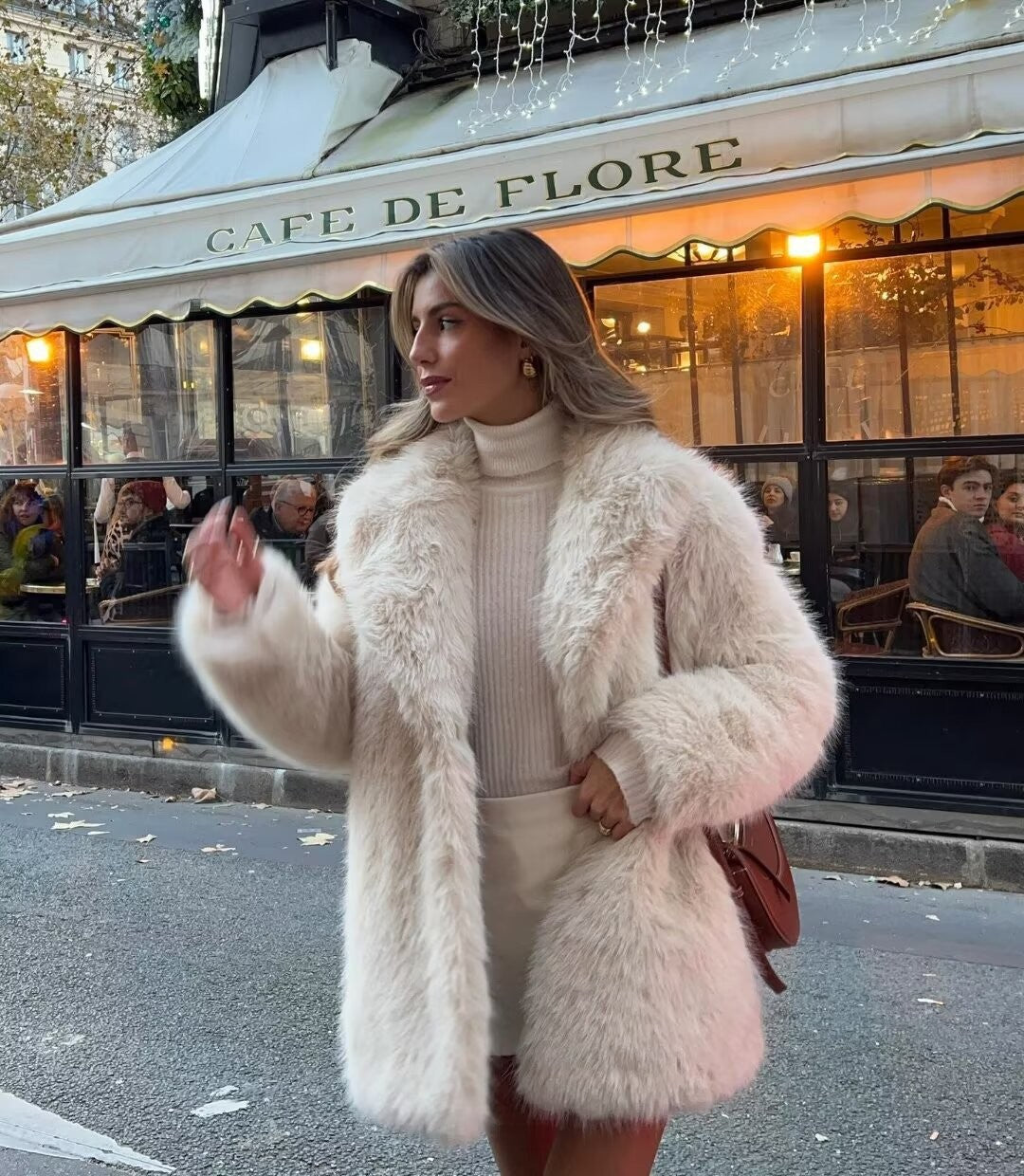 Women's luxury off-white winter jacket, elegantly designed for warmth & comfort. Ideal stylish outerwear.