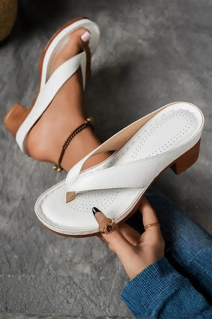 Elegant metallic block heel sandals for women, stylish toe post design for casual or evening wear.