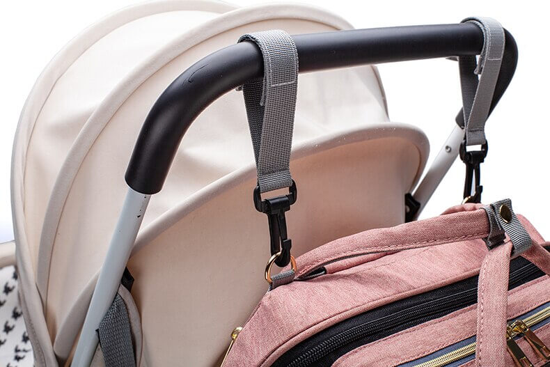Durable multi-function diaper backpack and portable baby bed, designed for modern moms.